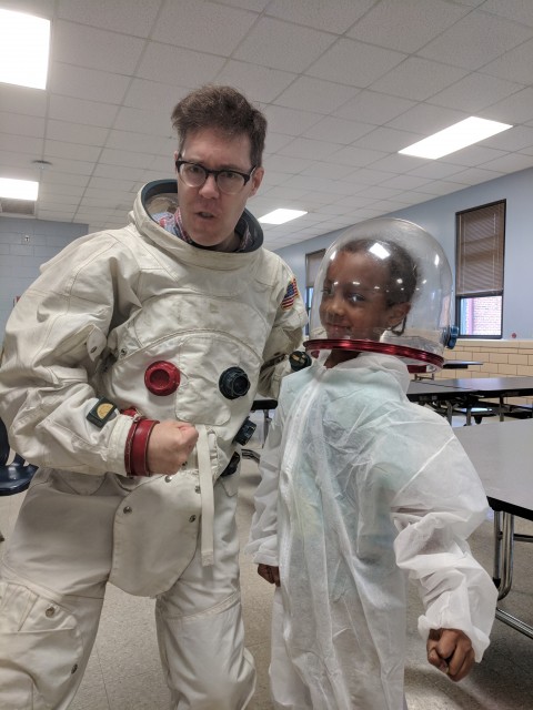 Spaceman Rick poses with young student at the Montrose Summer BLAST program.