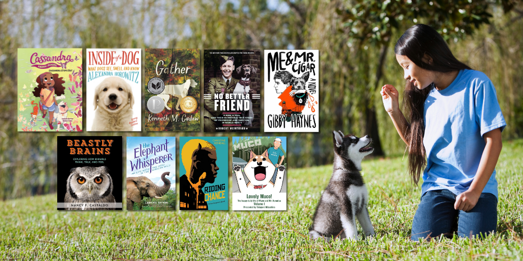 A teen kneels in the grass next to a sitting husky puppy. The teen holds a treat above the husky's head, and it stares attentively. To the left of the husky is a grid of nine book covers. The books are about animals and are geared toward teens.