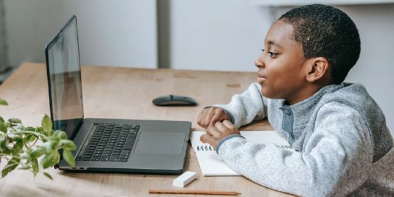 Young man looking at a laptop screen