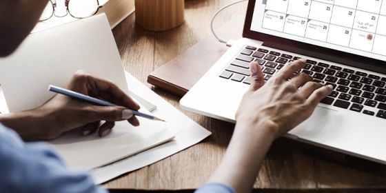 image of a person working on a laptop